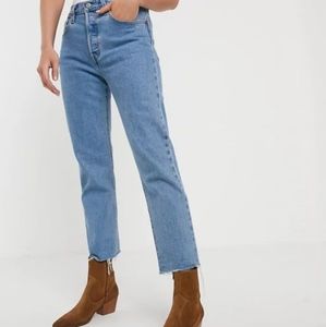 Levi 501 frayed him crop. Size 34.